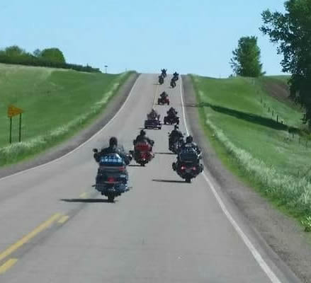 Participants in the Forever Jen Memorial Run on their motorcycles.