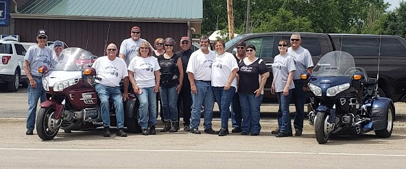 Group of participants with their motorcycles at a Forever Jen Memorial Motorcycle Run