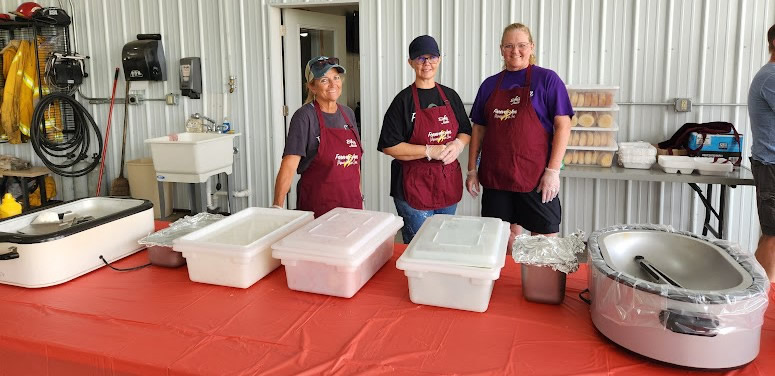 Volunteers preparing to serve a meal at a Forever Jen Memorial Fundraiser