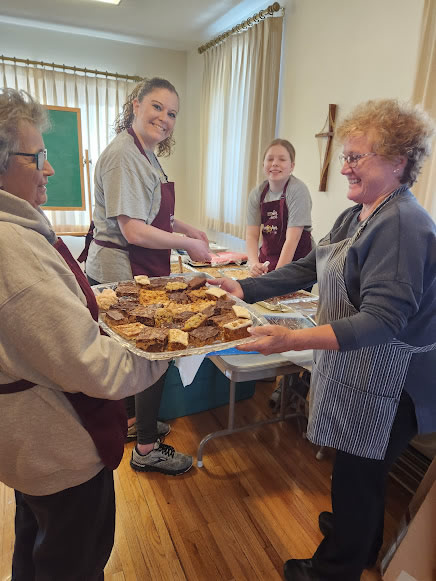 Volunteers getting ready to serve dessert at a Forever Jen Memorial fundraiser